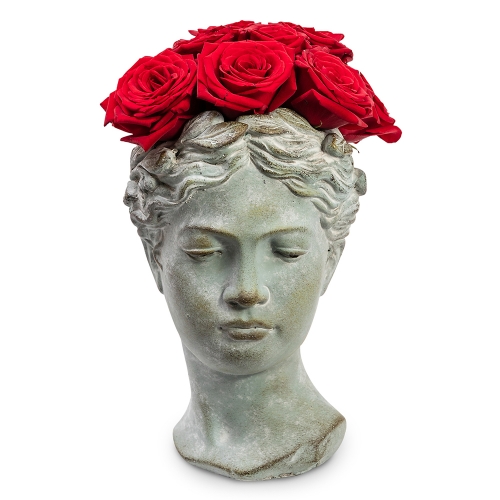 Stone face with red roses